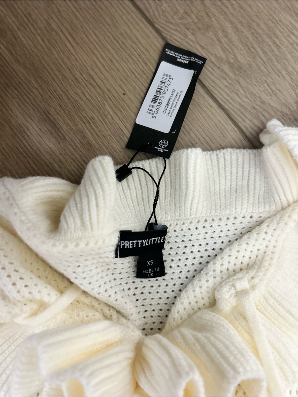 PrettyLittleThing Cream Off-Shoulder Ruffle Mini Dress - Picture 3 of 3